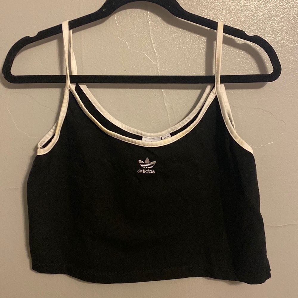 Black and white Adidas tank top in a size large:))